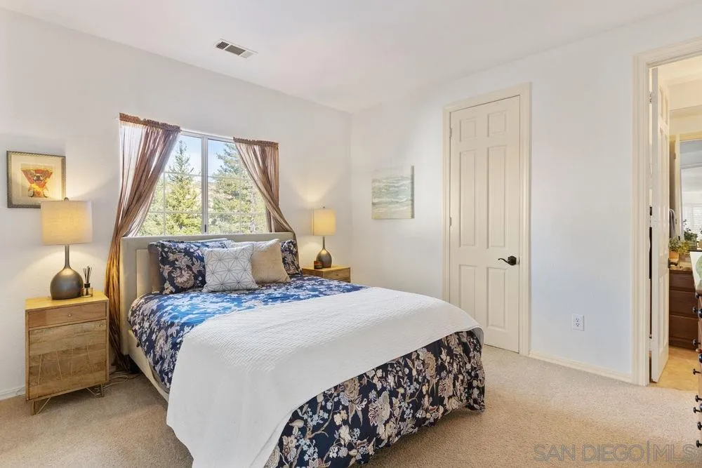 14331 Twisted Branch Road Poway, CA 92064 - Photo 20 of 25 a bedroom with a bed and a window