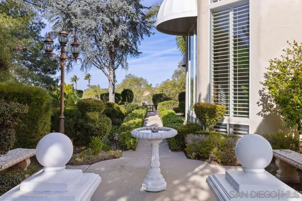 14331 Twisted Branch Road Poway, CA 92064 - Photo 25 of 25 a view of a patio with table and chairs potted plants and a fountain