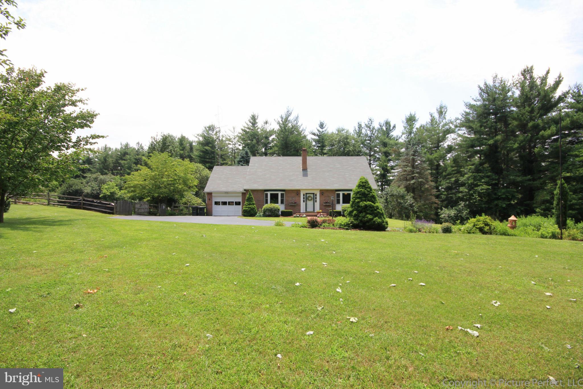8309 Palmer Road Middletown, MD 21769 - Photo 3 of 29 a view of a house with a big yard