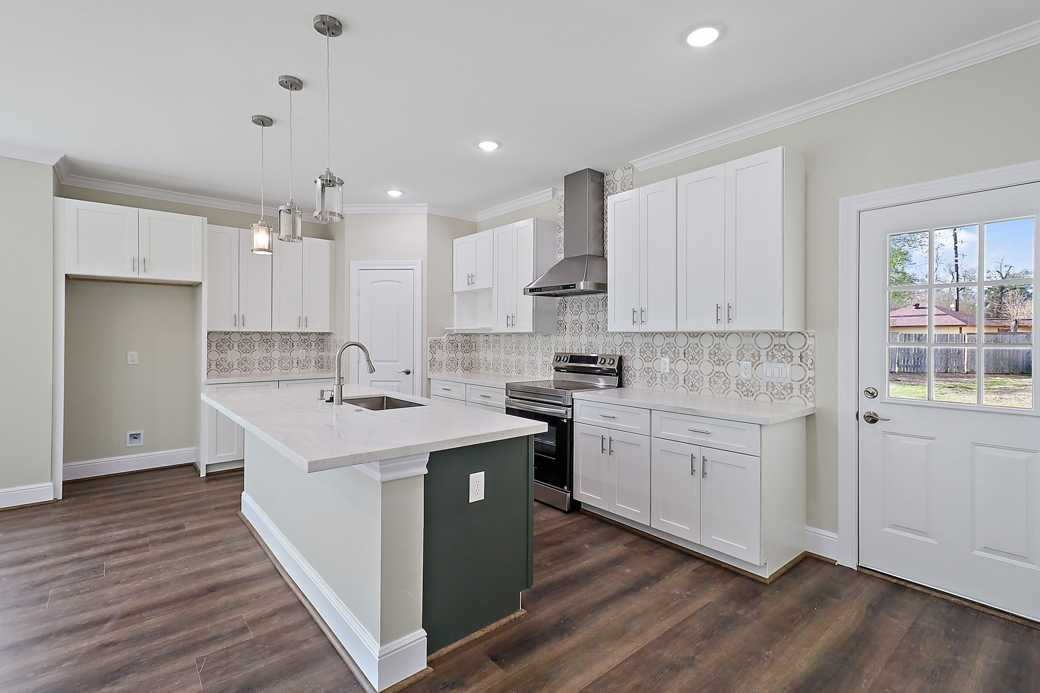 15907 Castaway Court Crosby, TX 77532 - Photo 12 of 26 a kitchen with sink stove and cabinets