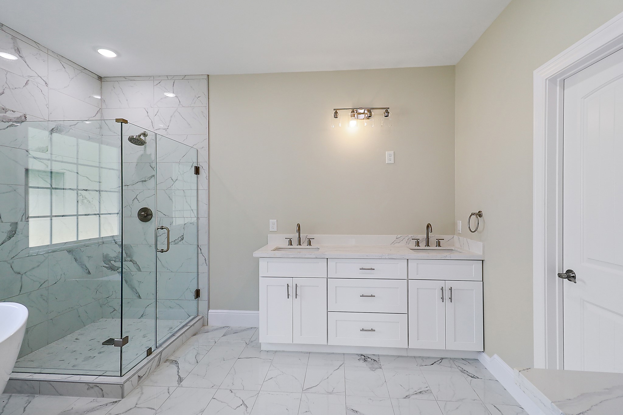 15907 Castaway Court Crosby, TX 77532 - Photo 13 of 26 a spacious bathroom with a shower sink and mirror