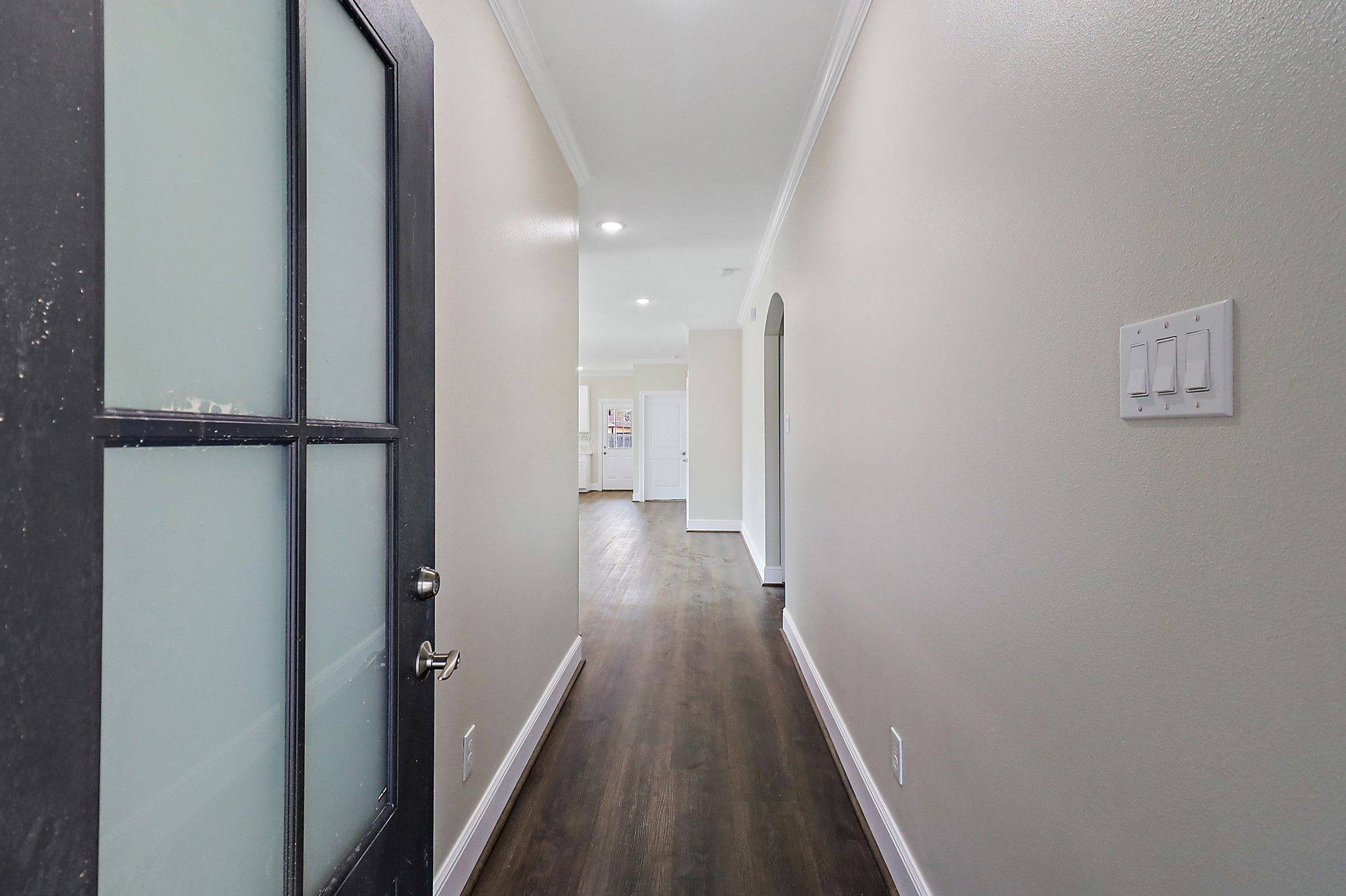 15907 Castaway Court Crosby, TX 77532 - Photo 3 of 26 a view of a hallway with wooden floor and staircase