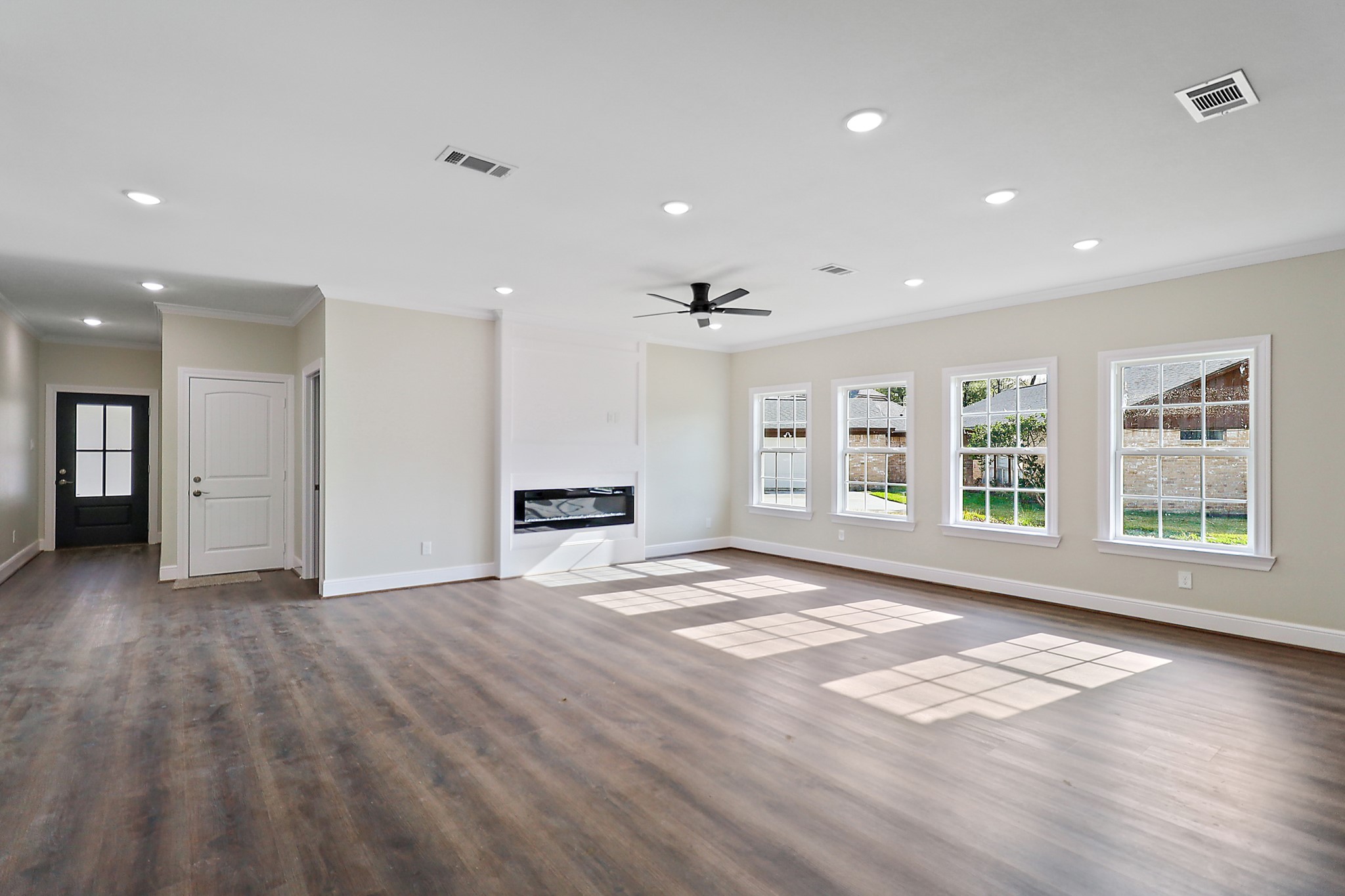 15907 Castaway Court Crosby, TX 77532 - Photo 7 of 26 a view of an empty room with a window and wooden floor
