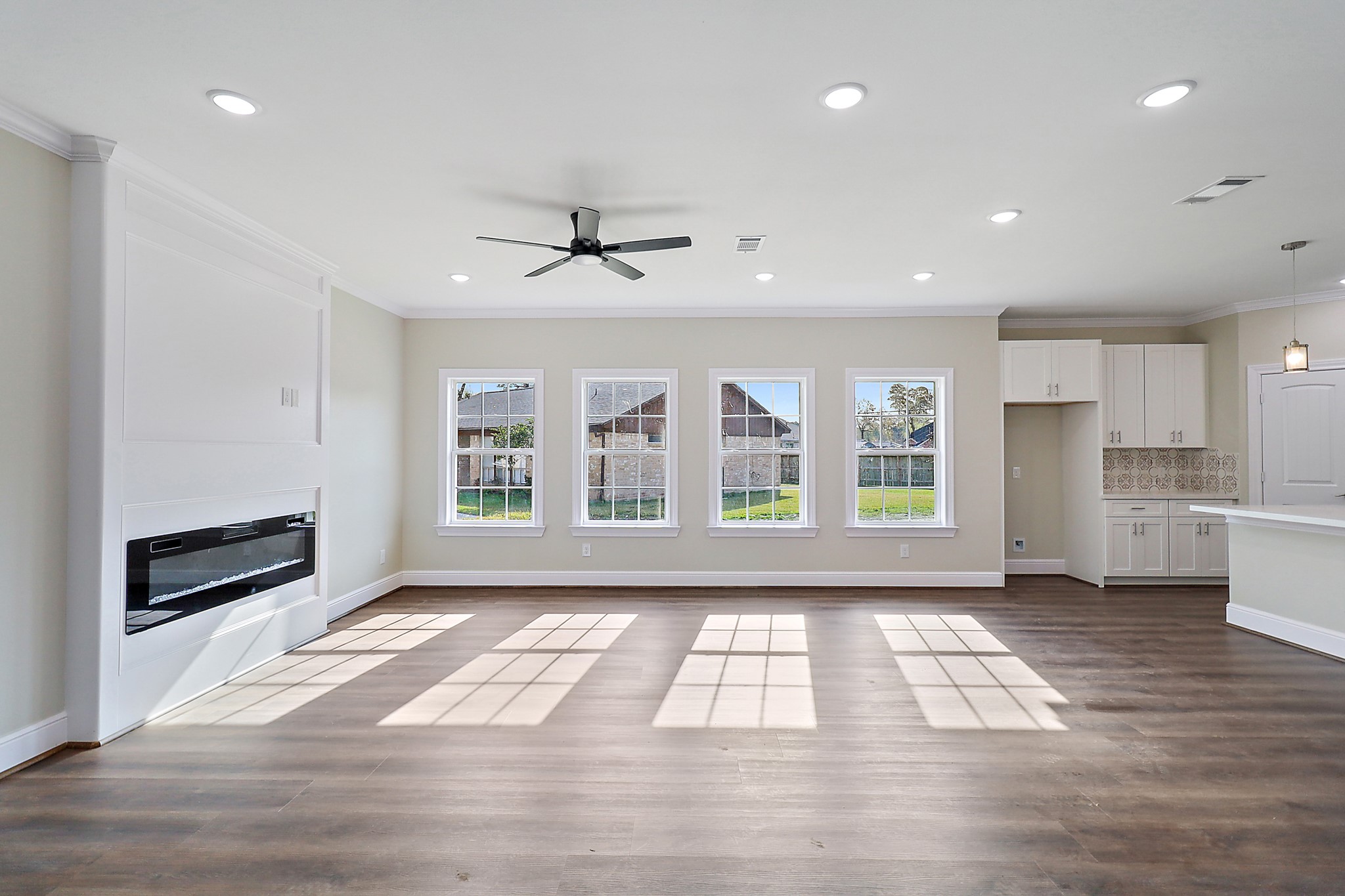 15907 Castaway Court Crosby, TX 77532 - Photo 8 of 26 a view of an empty room with a window and wooden floor