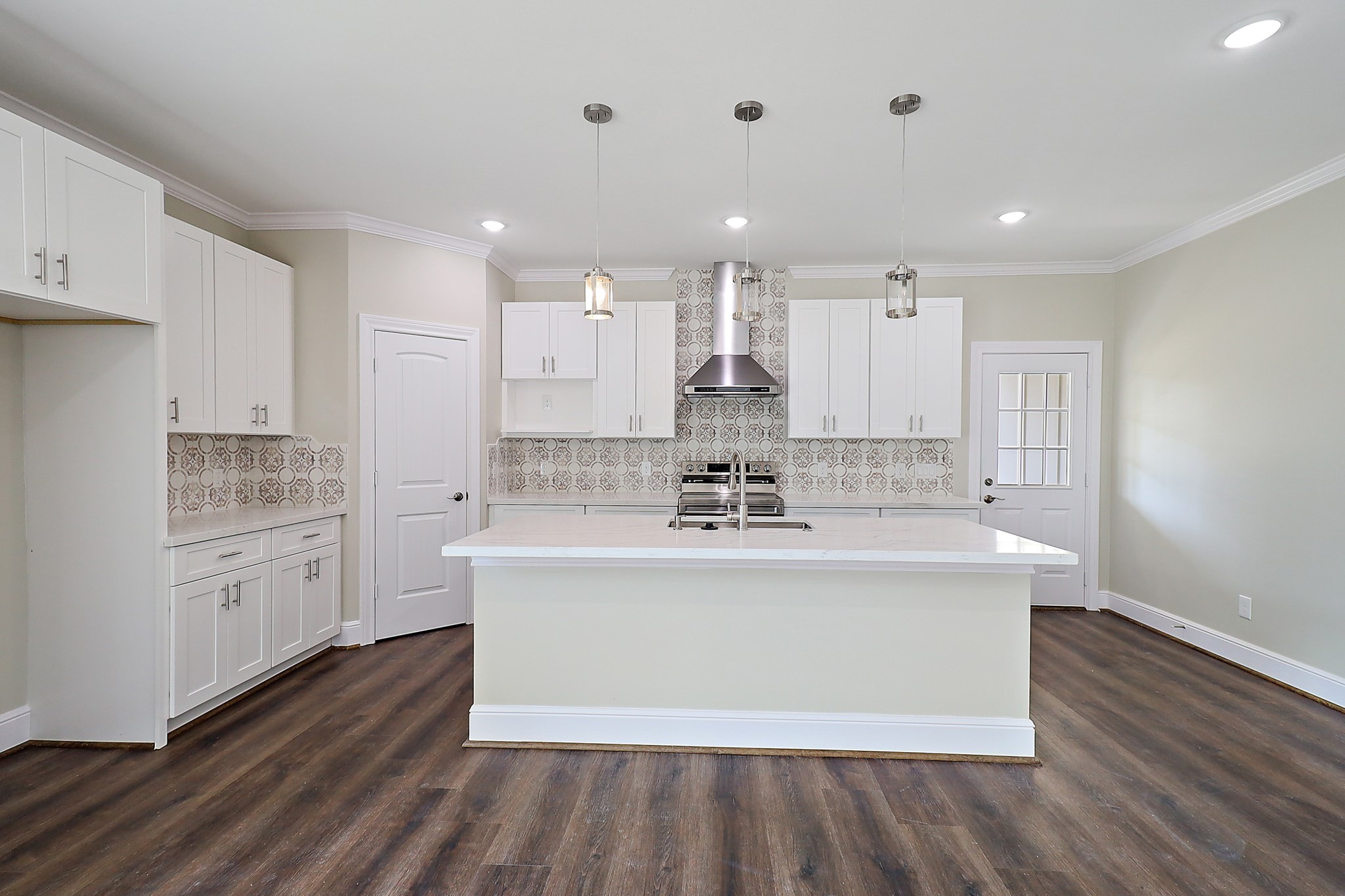 15907 Castaway Court Crosby, TX 77532 - Photo 10 of 26 a large kitchen with stainless steel appliances a large counter top a stove and a refrigerator