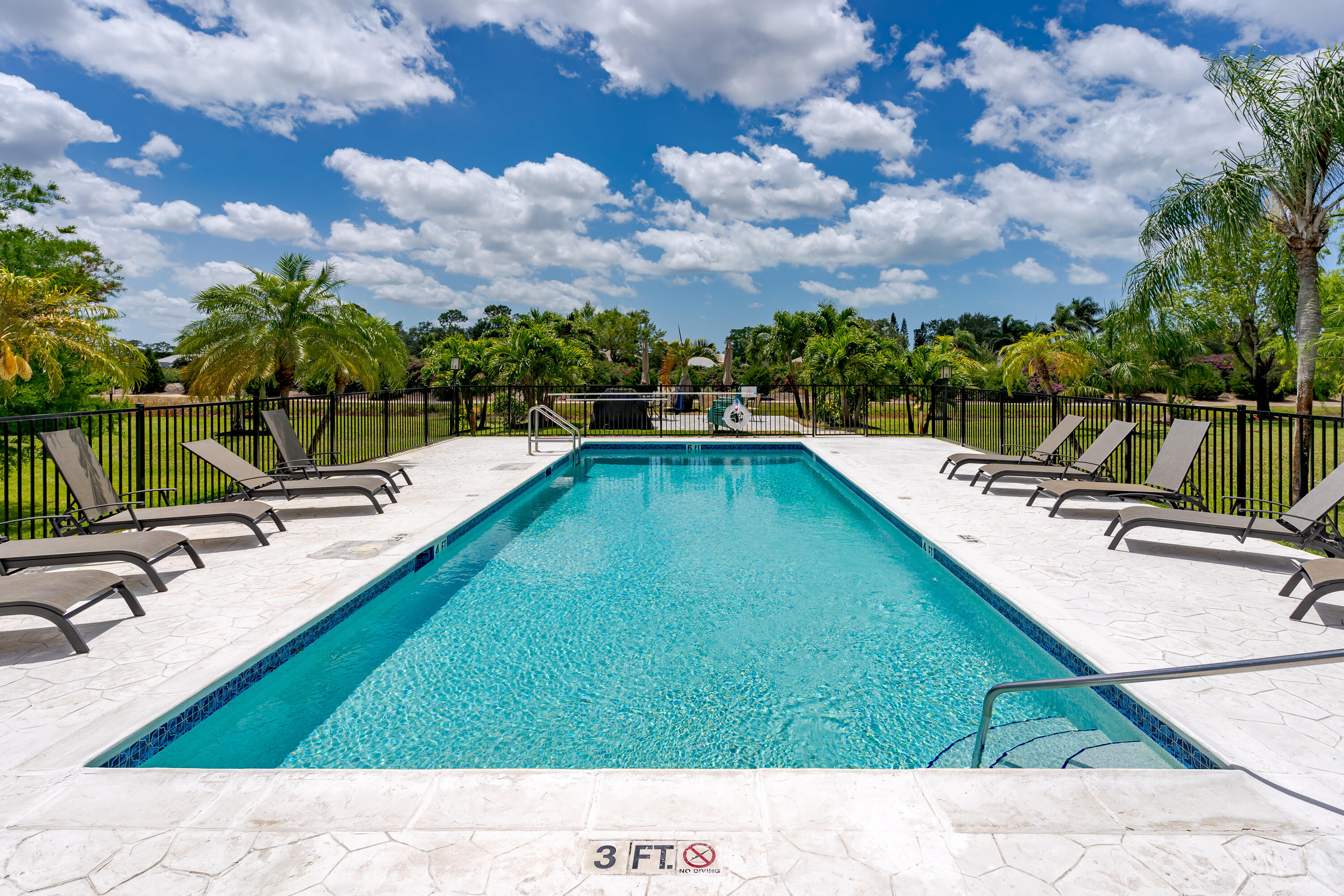 5697 Rattlesnake Hammock Road, Unit C201 Naples, FL 34113 - Photo 21 of 27 Pool Sundeck