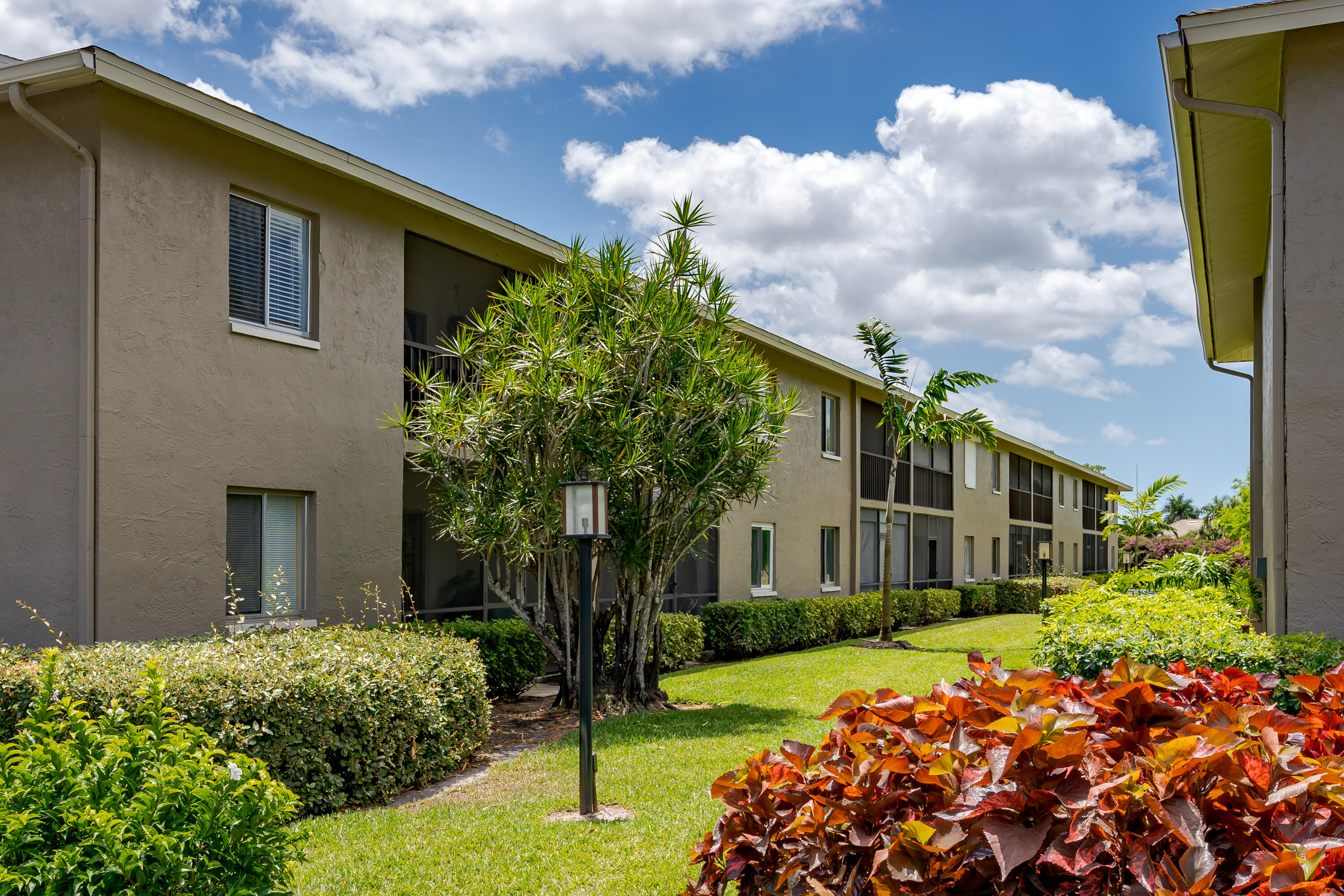 5697 Rattlesnake Hammock Road, Unit C201 Naples, FL 34113 - Photo 27 of 27 Back Building View