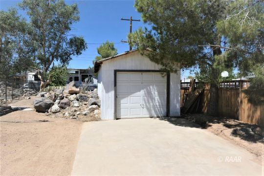 1263 Primrose Street Ridgecrest, CA 93555 - Photo 34 of 35 a view of a backyard of the house