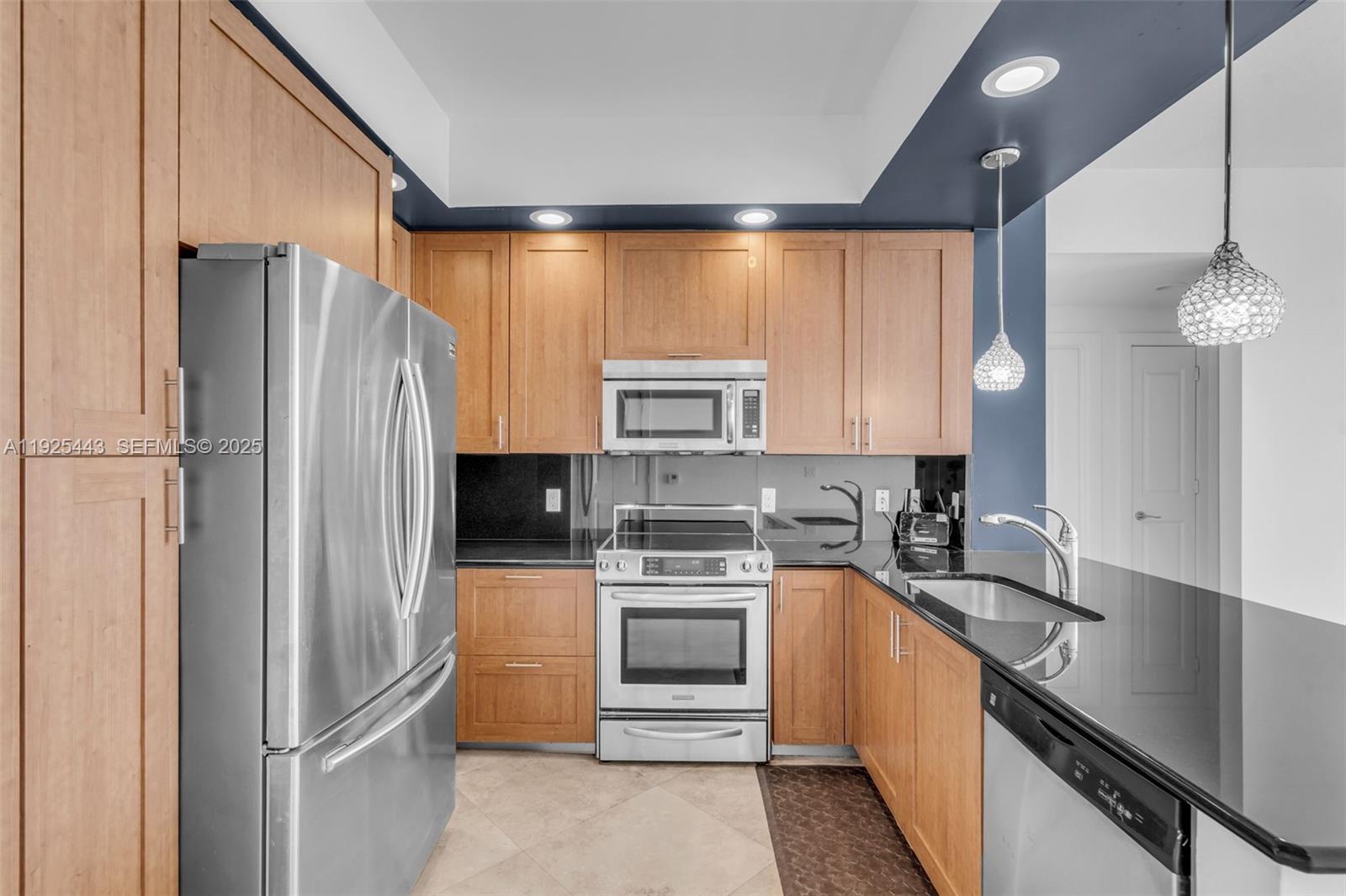 315 Northeast 3rd Avenue, Unit 1805 Fort Lauderdale, FL 33301 - Photo 13 of 43 a kitchen with a refrigerator and a sink
