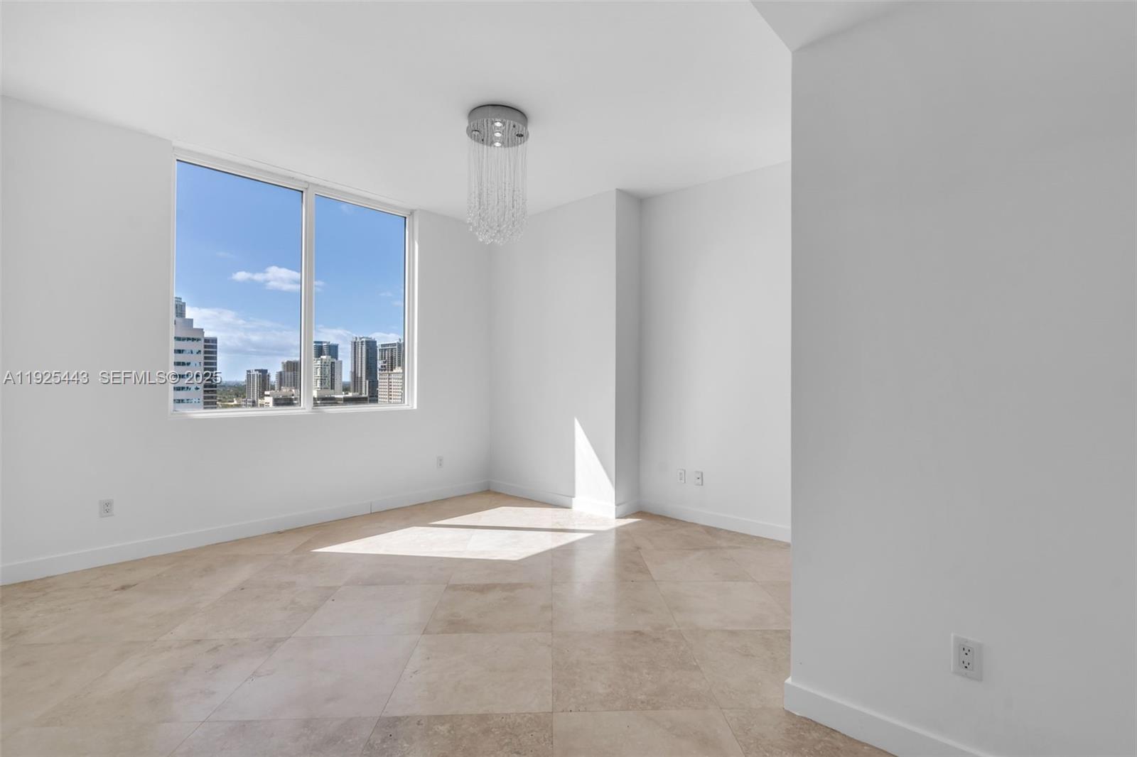 315 Northeast 3rd Avenue, Unit 1805 Fort Lauderdale, FL 33301 - Photo 15 of 43 a view of an empty room with a window