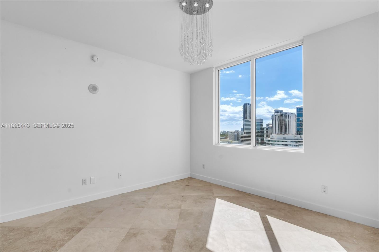315 Northeast 3rd Avenue, Unit 1805 Fort Lauderdale, FL 33301 - Photo 18 of 43 a view of an empty room with a window