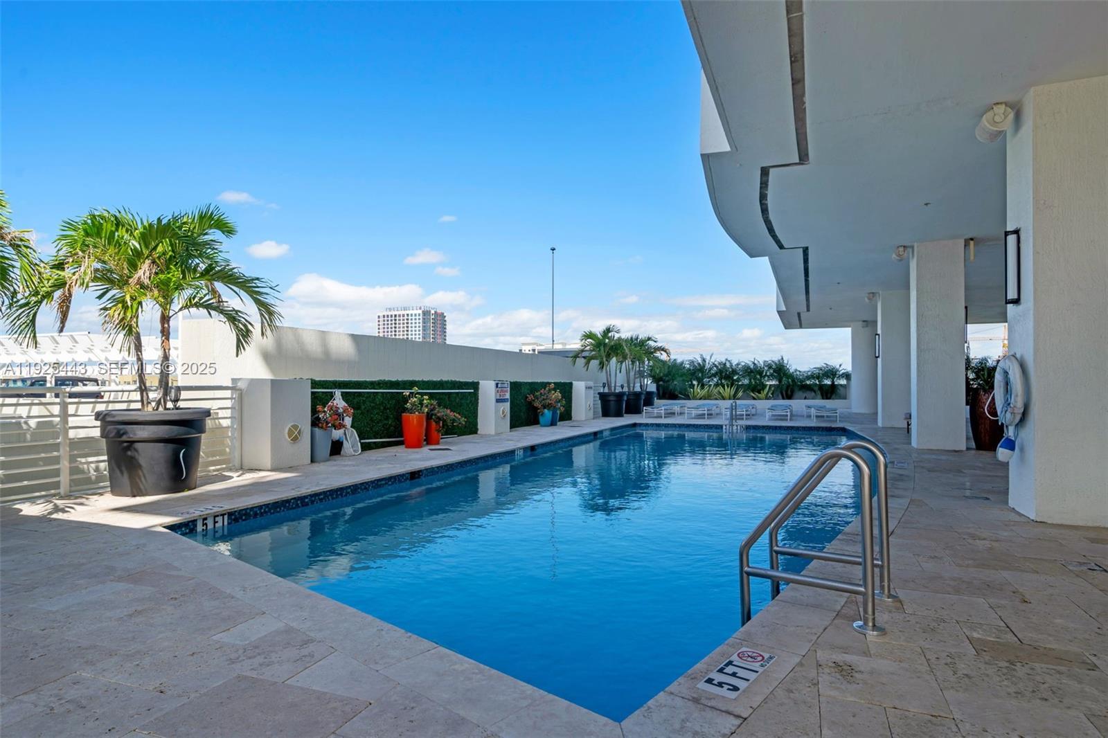 315 Northeast 3rd Avenue, Unit 1805 Fort Lauderdale, FL 33301 - Photo 33 of 43 a view of a swimming pool and dining room