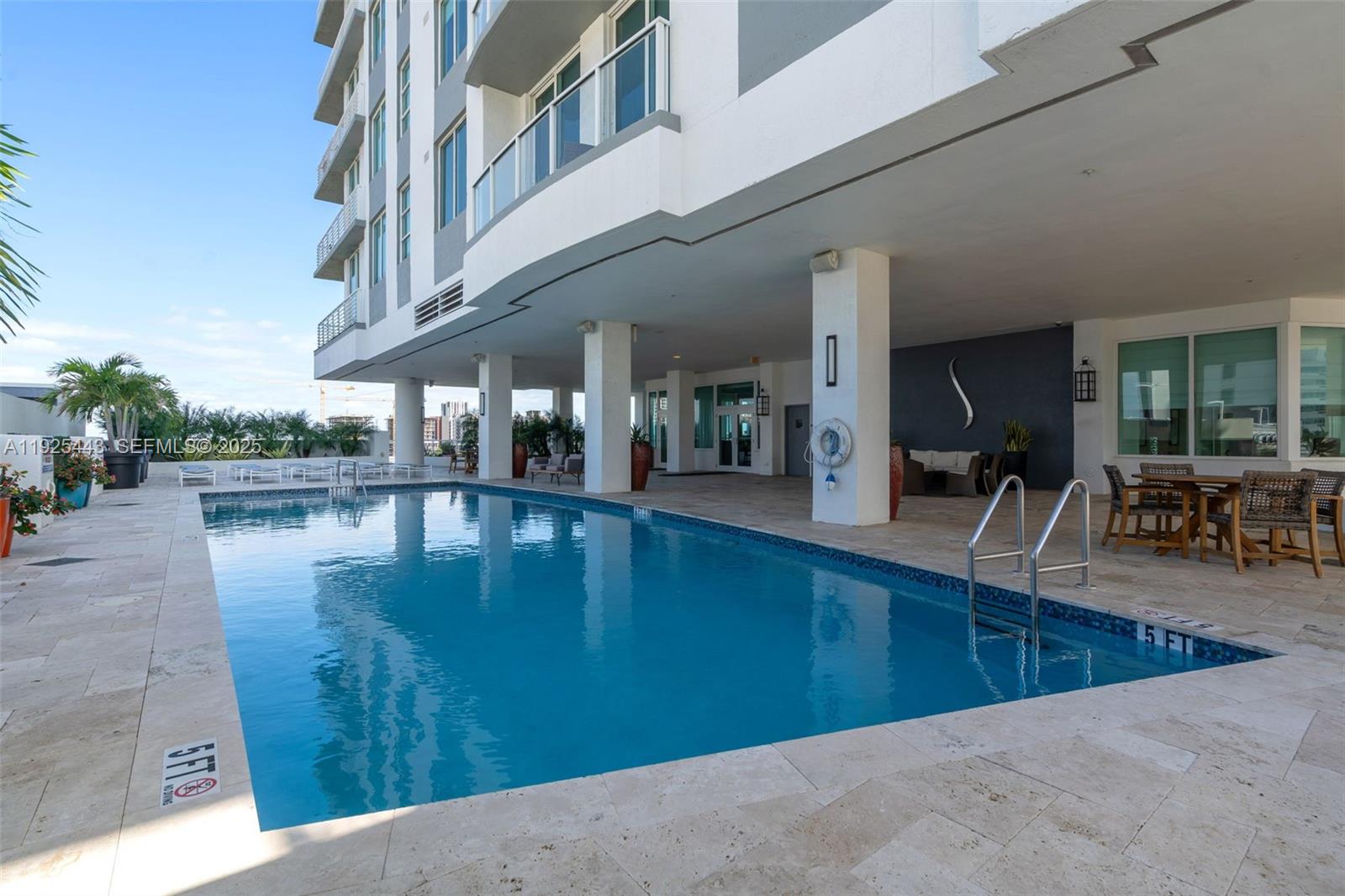 315 Northeast 3rd Avenue, Unit 1805 Fort Lauderdale, FL 33301 - Photo 34 of 43 a view of a swimming pool with outdoor seating