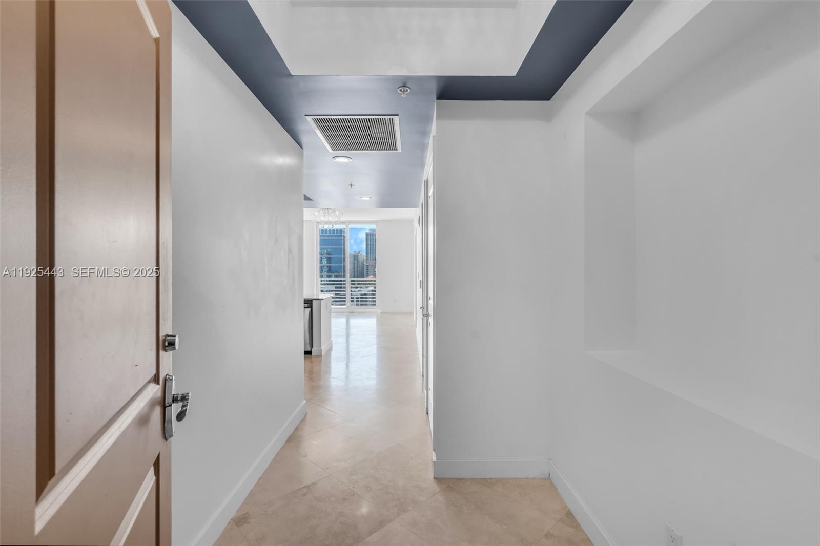 315 Northeast 3rd Avenue, Unit 1805 Fort Lauderdale, FL 33301 - Photo 6 of 43 a view of a hallway with a wooden floors