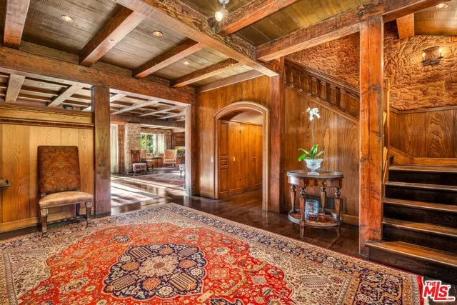 a living room with lots of furniture and a rug