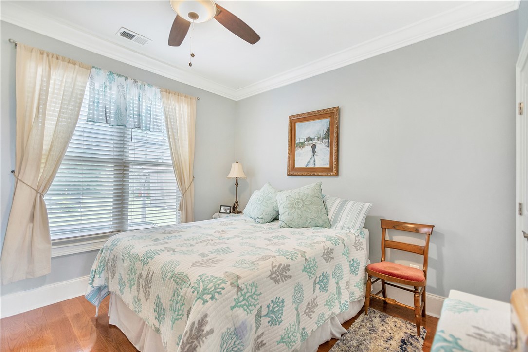 1204 Cherokee Road Townville, SC 29689 - Photo 26 of 44 Hardwood flooring and ample natural light enhance the serene atmosphere of this inviting sleeping area.