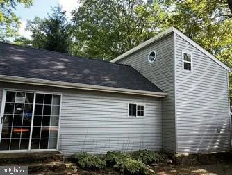 a view of house with a tree