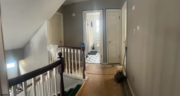 a white toilet sitting next to a shower