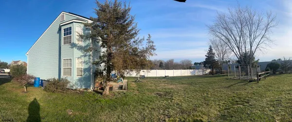 a couple of cars parked in front of a house