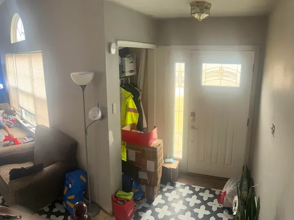 a view of a hallway with furniture and a hallway