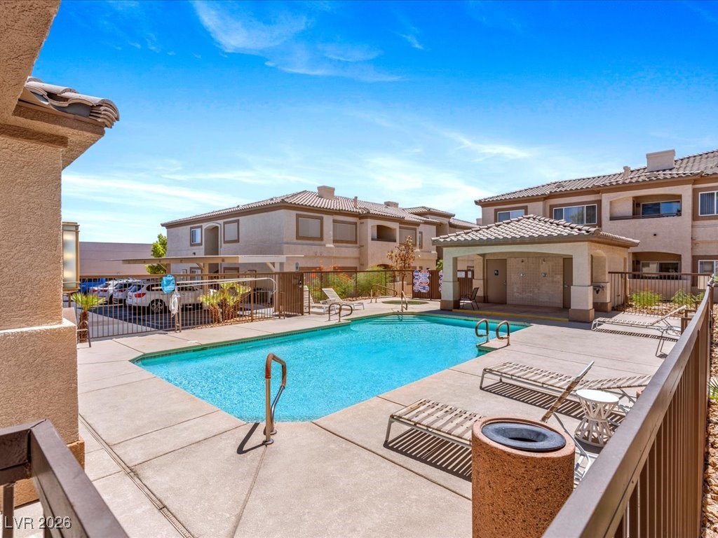 8725 West Flamingo Road, Unit 235 Las Vegas, NV 89147 - Photo 3 of 22 Community pool with a patio area