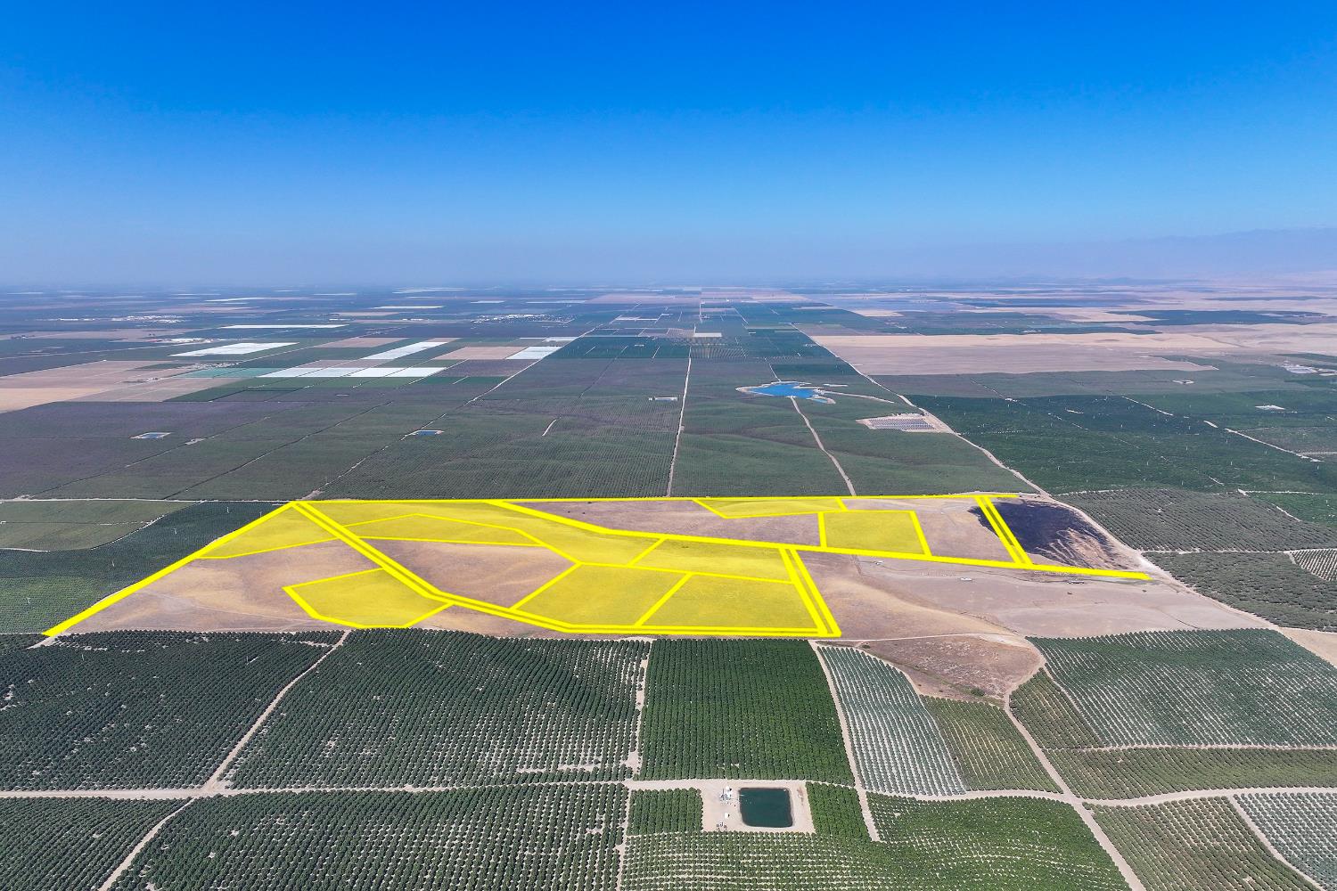 a view of a swimming pool with lounge chairs