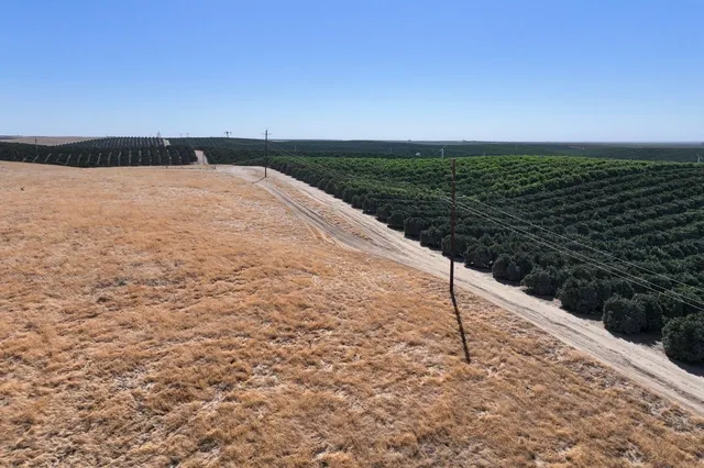 a view of an ocean beach and mountain