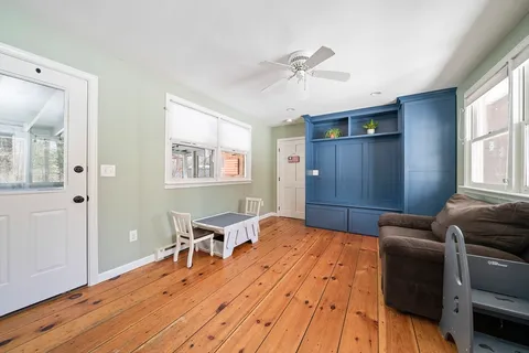 a bedroom with furniture and window