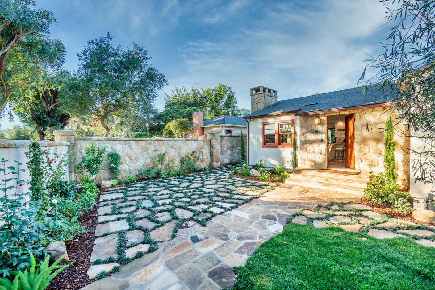 2162 East Valley Road Montecito, CA 93108 - Photo 21 of 23 a view of a backyard with plants and large trees
