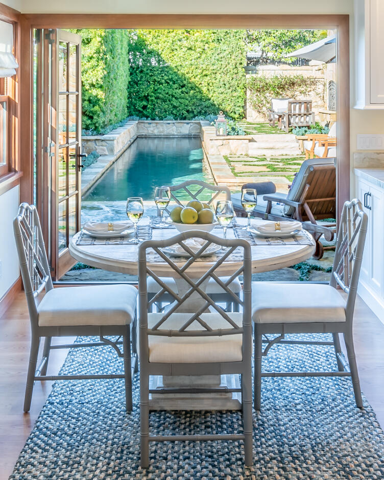 2162 East Valley Road Montecito, CA 93108 - Photo 22 of 23 a view of a dining room with furniture a rug and a floor to ceiling window