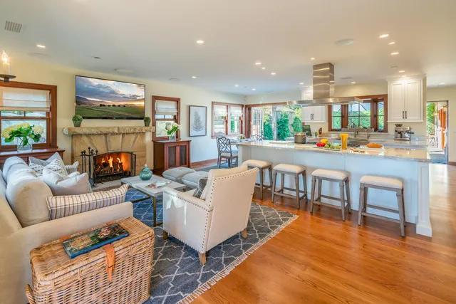 a living room with fireplace furniture and a flat screen tv