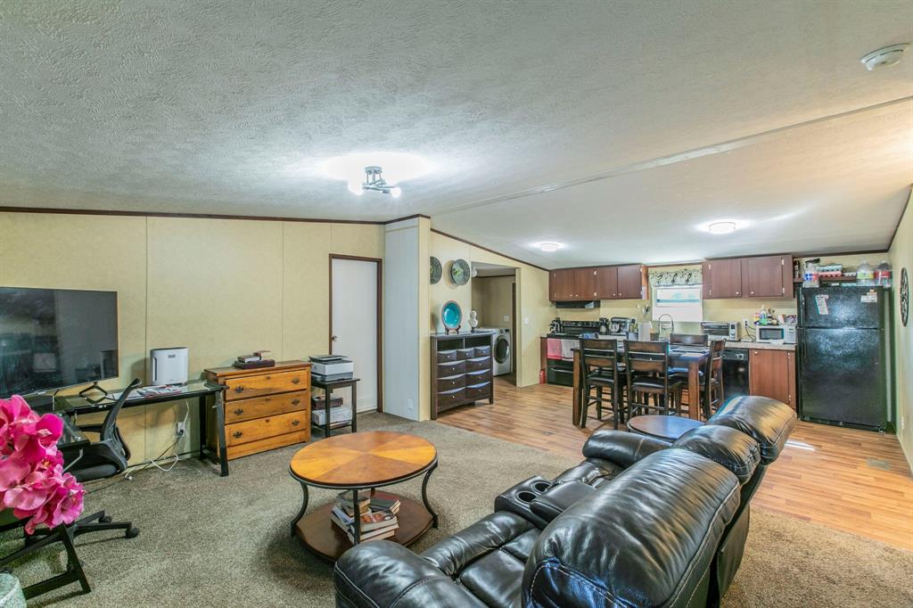142 Lillie Valley Road Waco, TX 76705 - Photo 11 of 35 a living room with furniture and kitchen view