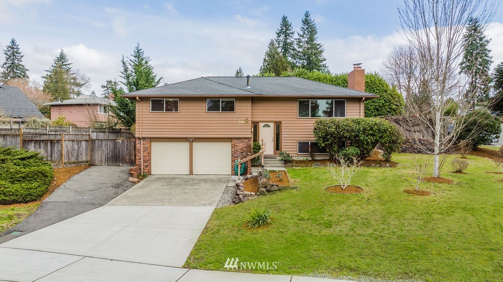 316 158th Place Southeast Bellevue, WA 98008 - Photo 1 of 29 a front view of house with yard and green space