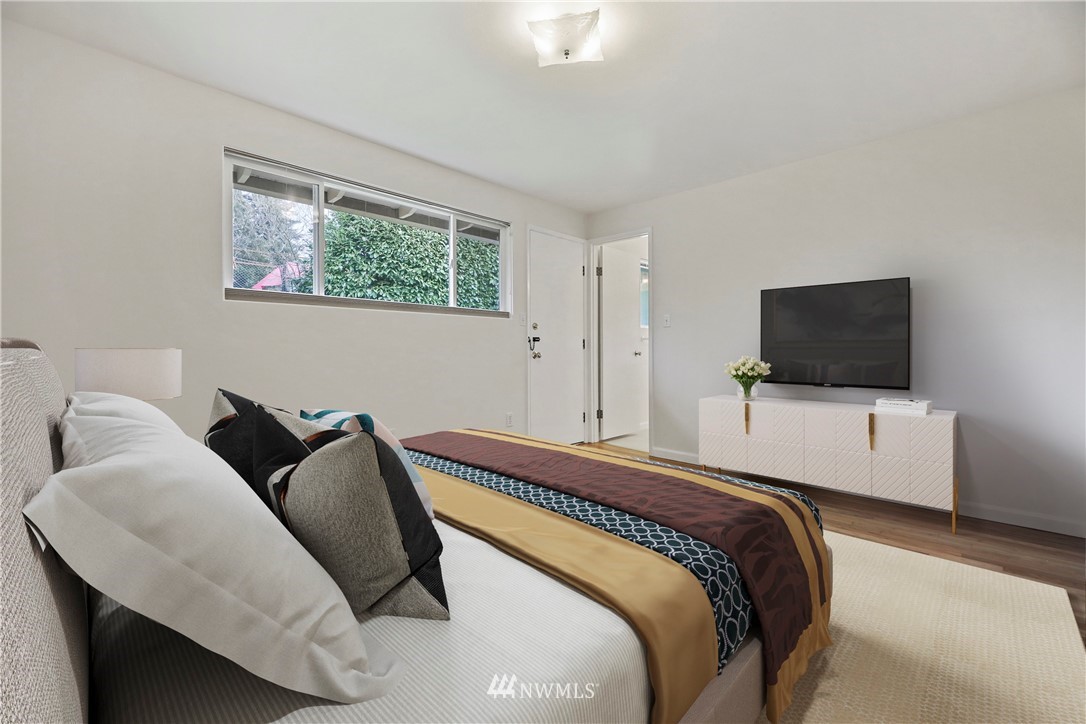 316 158th Place Southeast Bellevue, WA 98008 - Photo 11 of 29 a bedroom with a bed and a flat screen tv