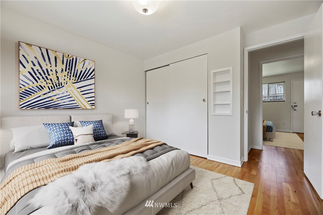 316 158th Place Southeast Bellevue, WA 98008 - Photo 14 of 29 a bedroom with a bed and wooden floor