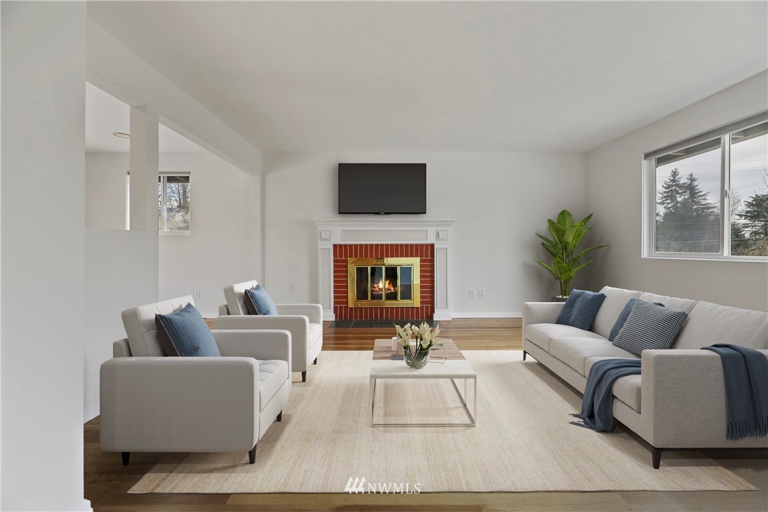 316 158th Place Southeast Bellevue, WA 98008 - Photo 4 of 29 a living room with furniture and a fireplace