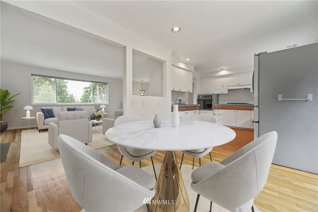 316 158th Place Southeast Bellevue, WA 98008 - Photo 5 of 29 a large living room with stainless steel appliances granite countertop furniture and a large window