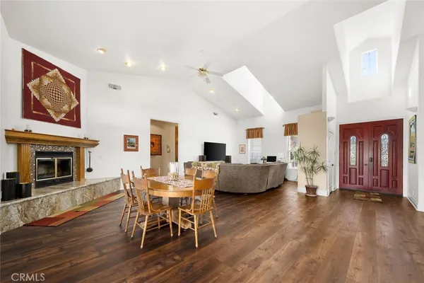 a living room with furniture a rug and a flat screen tv
