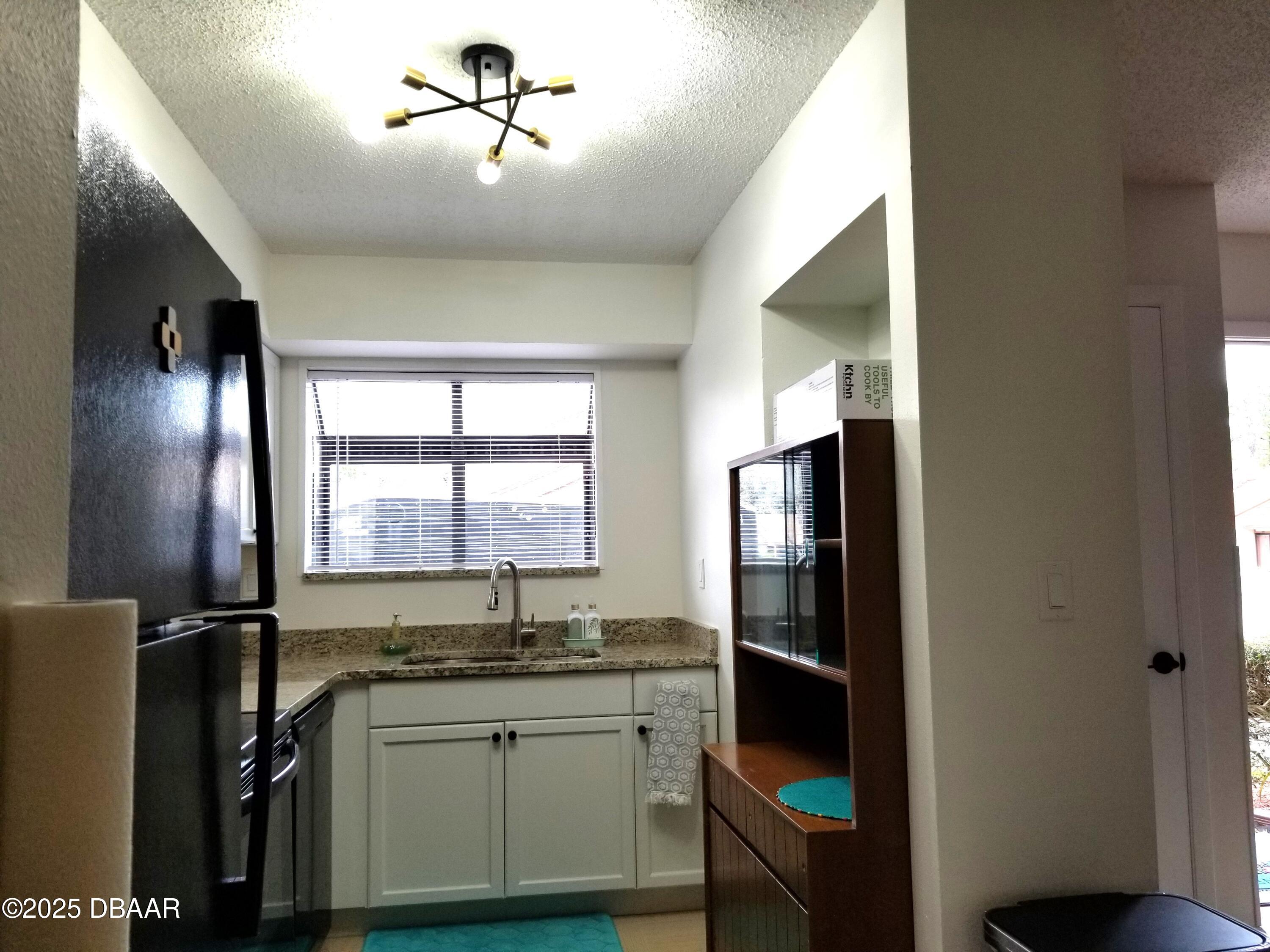 165 White Fawn Drive, Unit MB Daytona Beach, FL 32114 - Photo 7 of 34 165-Kitchen2