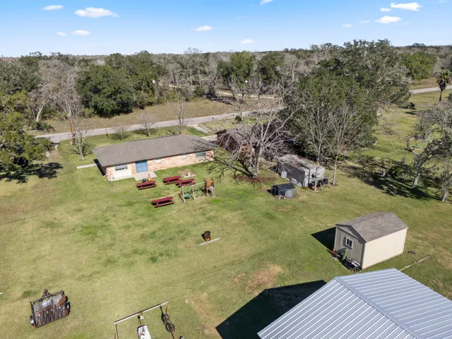 a room with a bed and a table in it