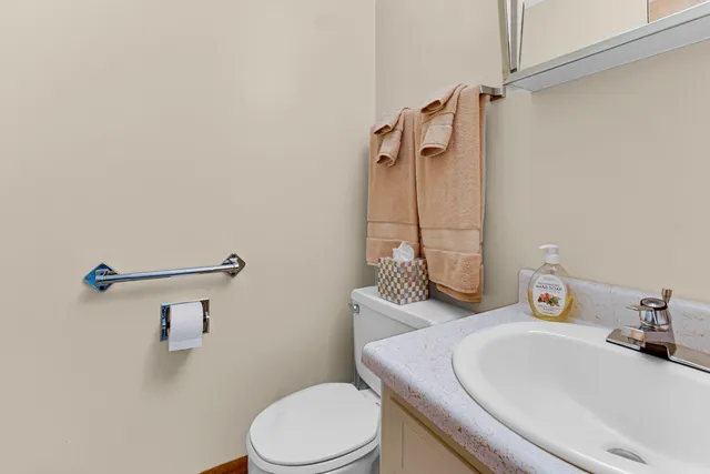 a bathroom with a sink a vanity and a mirror