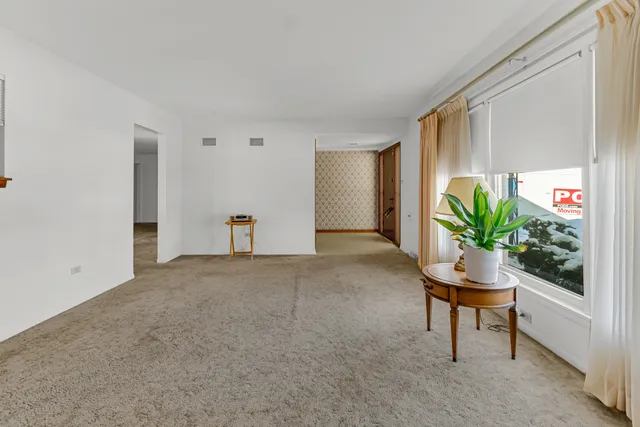 a workspace with furniture and a potted plant