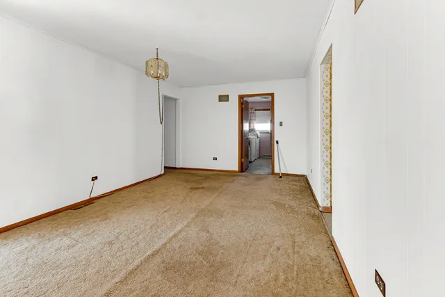 a view of empty room with ceiling fan
