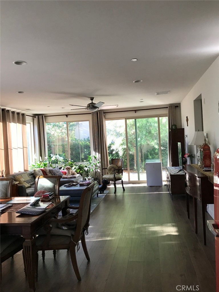 100 Desert Bloom Irvine, CA 92618 - Photo 11 of 15 a living room with furniture and a large window