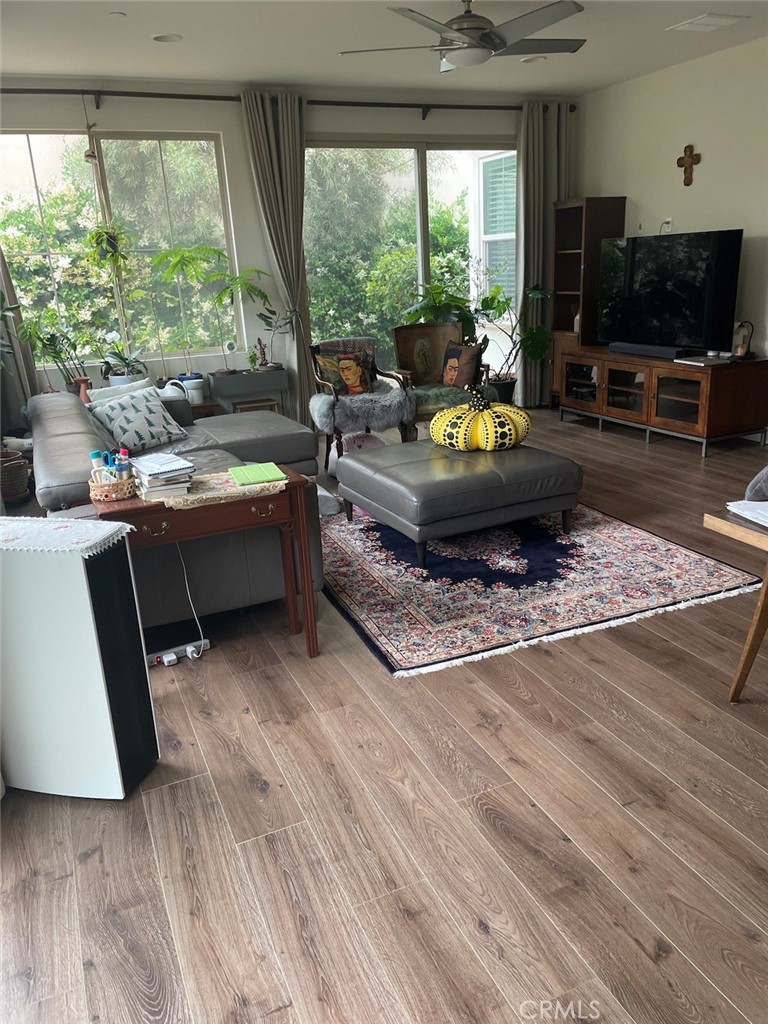 100 Desert Bloom Irvine, CA 92618 - Photo 12 of 15 a living room with furniture large window and a flat screen tv