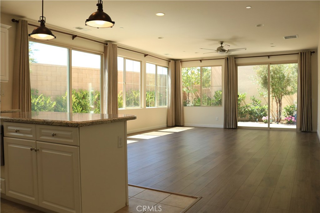 100 Desert Bloom Irvine, CA 92618 - Photo 2 of 15 a living room with hardwood floor and large windows