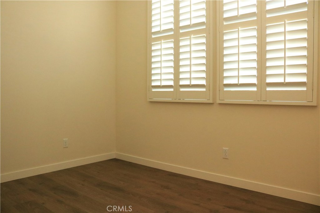 100 Desert Bloom Irvine, CA 92618 - Photo 6 of 15 wooden floor in an empty room with a window