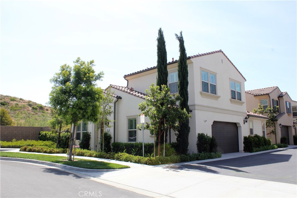 100 Desert Bloom Irvine, CA 92618 - Photo 8 of 15 a house with tree in front of it