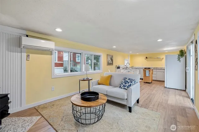 a living room with furniture and a potted plant