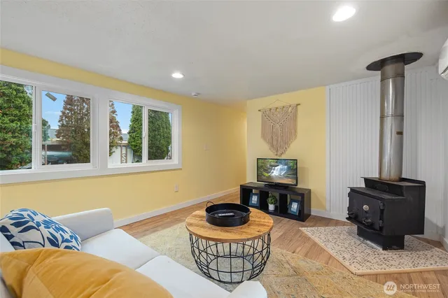 a living room with furniture and a rug